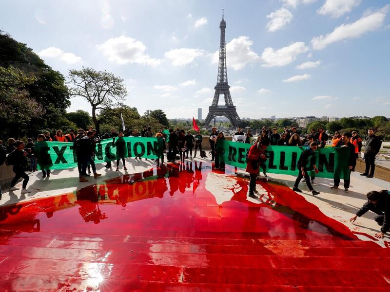 Extinction Rebellion (XR) is an international movement that uses non-violent civil disobedience to achieve radical change in order to minimise the risk of human extinction and ecological collapse.  FRANCOIS GUILLOT / AFP