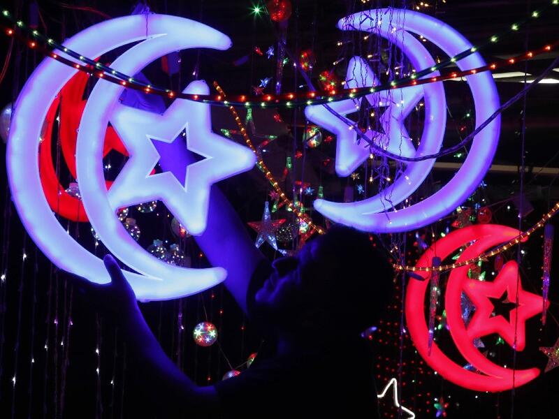 Muslims around the world prepare for the announcement of the fasting month of Ramadan which is expected to start on May 5 or 6 depending on the crescent moon.  AHMAD GHARABLI / AFP