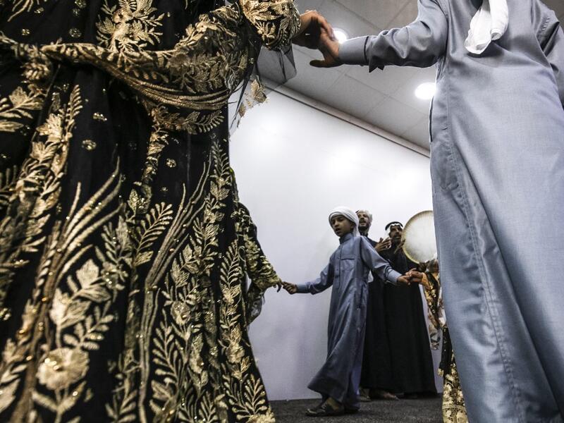 Members of a traditional music and dance group perform at the first cultural centre to open since the ISIS rule ended in the eastern Syrian city of Raqa on May 1, 2019. DELIL SOULEIMAN / AFP