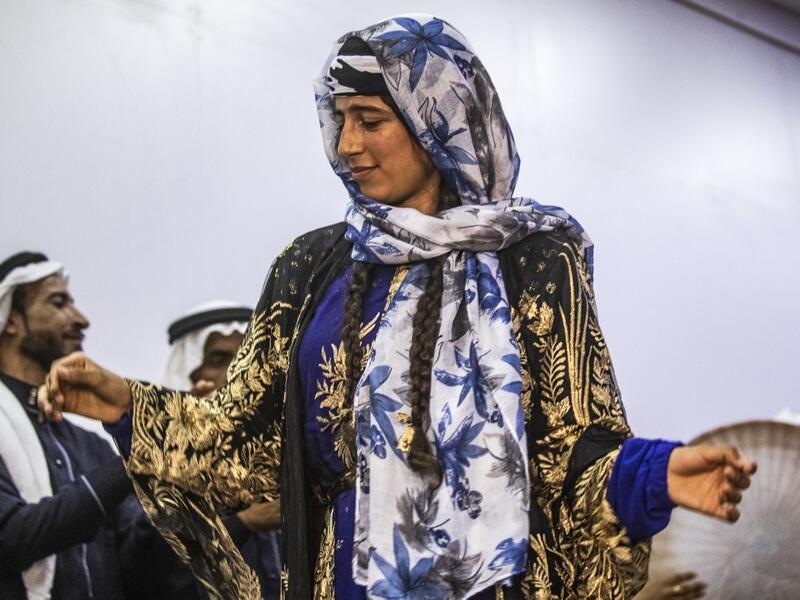 Sunlight floods into a brand new library at the cultural centre where books line shelves along a wall that still smells of wet paint. DELIL SOULEIMAN / AFP