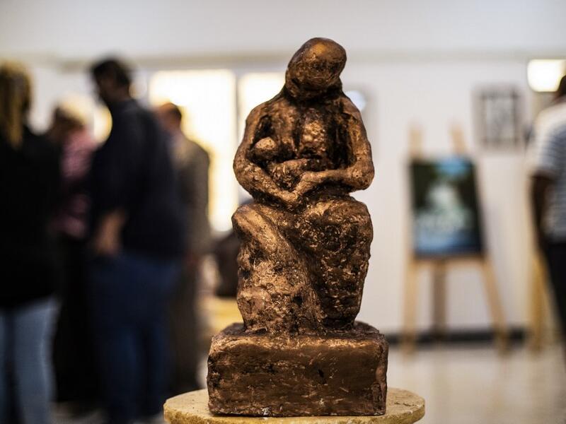 Sunlight floods into a brand new library at the cultural centre where books line shelves along a wall that still smells of wet paint. DELIL SOULEIMAN / AFP