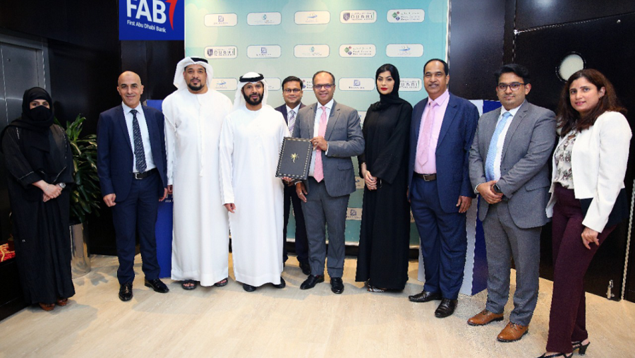 بنك أبوظبي الأول يوقع شراكة مع أراضي دبي