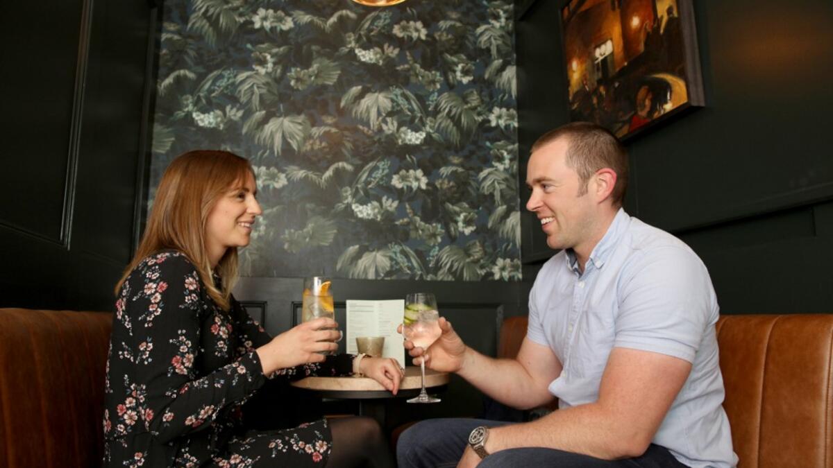 Customers Niamh and Padraic Minock enjoy their non-alcoholic drinks at the Virgin Mary pub, which opened recently selling non-alcoholic drinks and is known as the 'pub with no beer', in the city centre of Dublin on May 16, 2019. PAUL FAITH / AFP