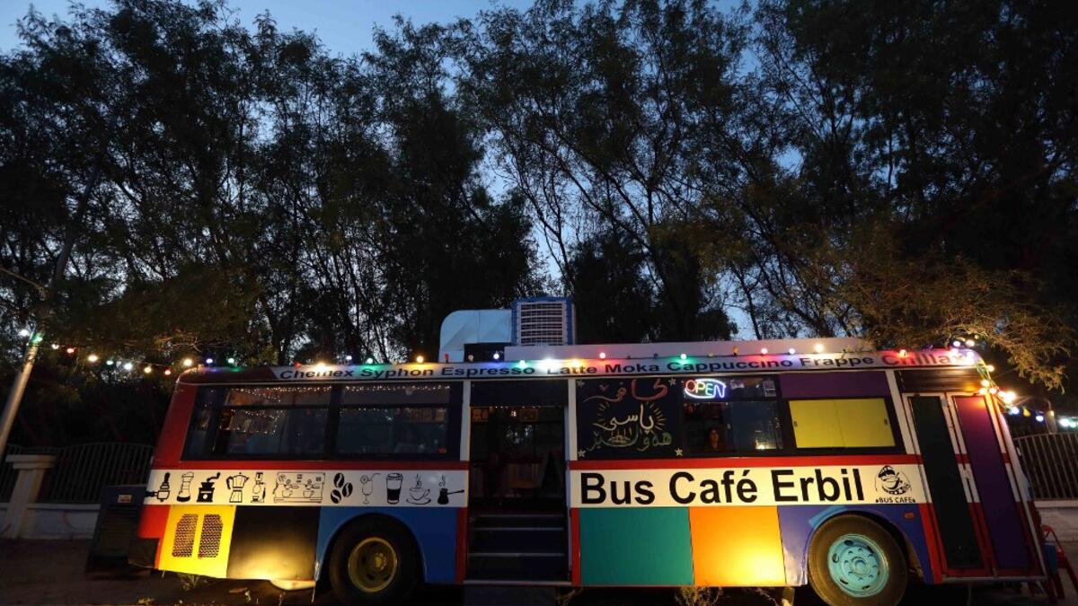 A picture taken late on June 7, 2019 shows "The Bus Cafe Erbil" in Arbil, the capital of Iraq's Kurdish autonomous region, on the long weekend of the Eid al-Fitr holiday which marks the end of the Muslim holy month of Ramadan.  SAFIN HAMED / AFP