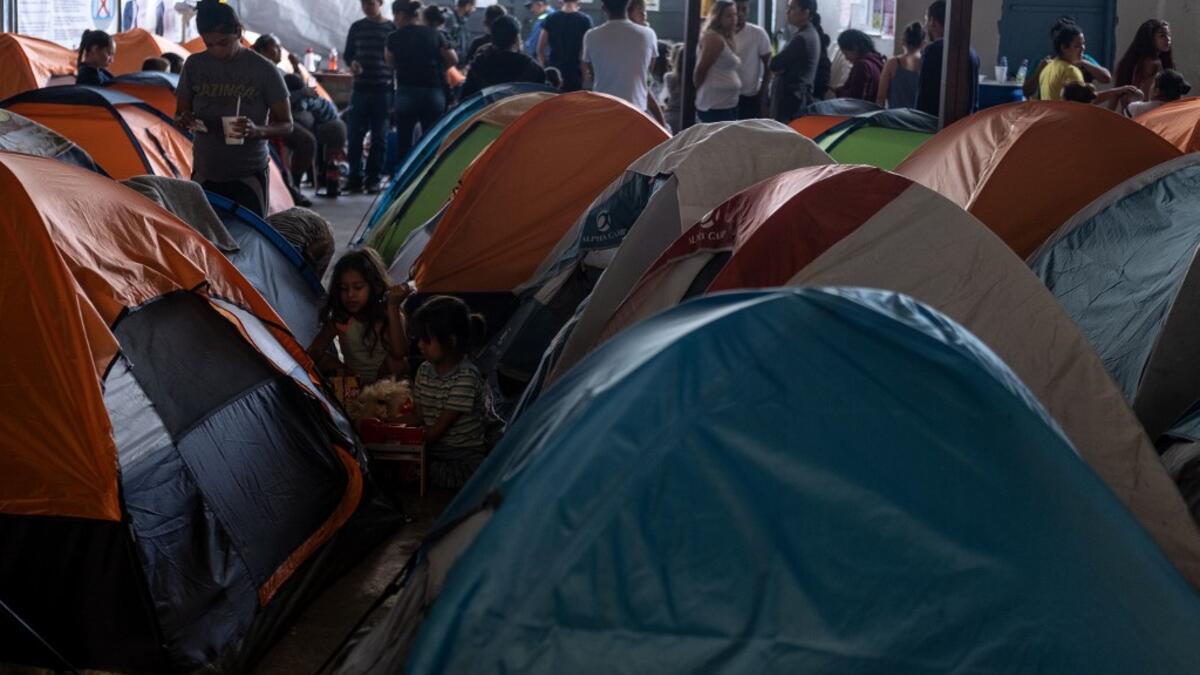 Migrants seeking for asylum in the United States are seen in Juventud 2000 migrant shelter in Tijuana, Baja California state, on June 19, 2019, Mexico ahead of World Refugees Day. World Refugee Day is observed June 20 each year internationally to raise awareness of the situation of refugees throughout the world.  (Guillermo Arias / AFP)