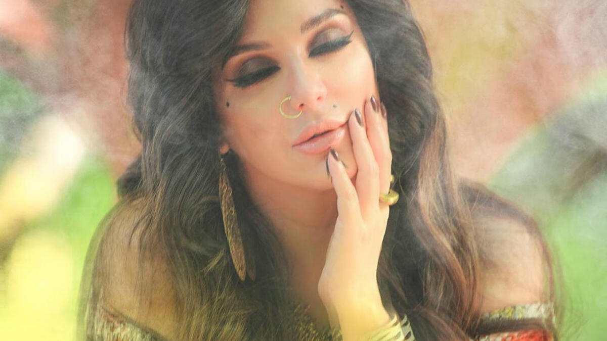 In her latest photos Fawakherji appeared in bright colored clothes and wavy hair Source sulaffawakherji Instagram