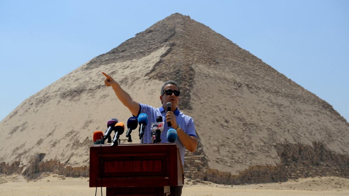 Egypt's Antiquities Minister Khaled El-Enany speaks in front of the Bent Pyramid of Sneferu during an inaugural ceremony of the pyramid and its satellites, on July 13, 2019. Mohamed el-Shahed / AFP
