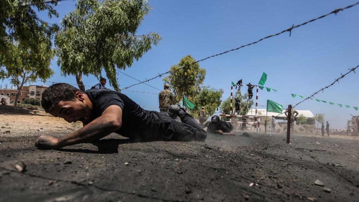 Palestinian military cadets take part in a training session organised by Hamas' military wing, the Ezzedin al-Qassam Brigades, in Gaza City on July 20, 2019.  MAHMUD HAMS / AFP