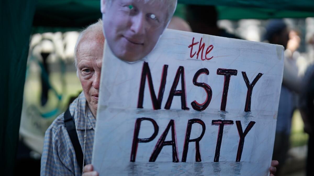 Demonstrators against Conservative Party leadership candidate Boris Johnson gather outside Downing Street with placards in central London on July 22, 2019 the eve of the announcement of the winner of the Tory leadership contest and who will become Britain's new prime minister.  Tolga Akmen / AFP