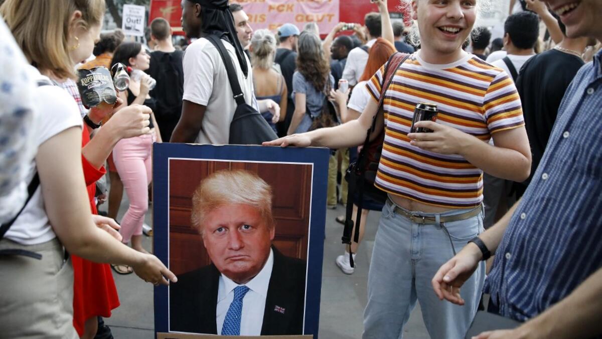 Demonstrators carry placards as they protest against Britain's newly appointed prime minister Boris Johnson outside Downing Street in London on July 24, 2019. Boris Johnson took charge as Britain's prime minister on Wednesday, on a mission to deliver Brexit by October 31 with or without a deal. Tolga AKMEN / AFP / POOL