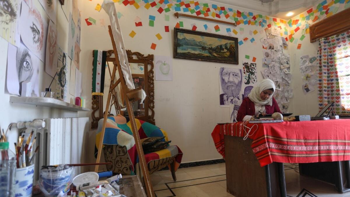 Through her cartoons, Ali has boldly challenged traditions to comment on life in the anti-regime bastion, and to condemn seeming international indifference to civilian deaths. Omar HAJ KADOUR / AFP