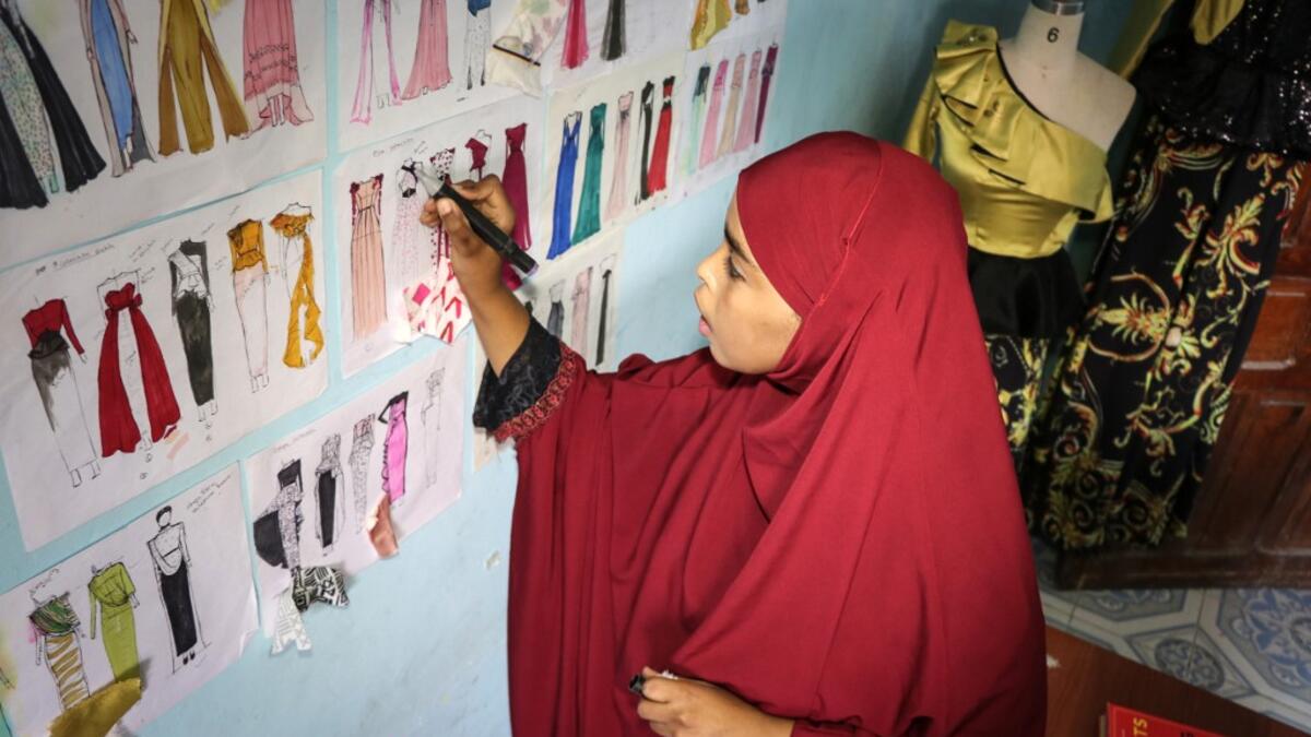 Somalia's clothes business is a simple one: foreign imported garments for the well-to-do, locally tailored clothes for the rest. But new fashion designers are complicating that picture with locally-designed, hand-made attire. Abdi HAJJI HUSSEIN / AFP