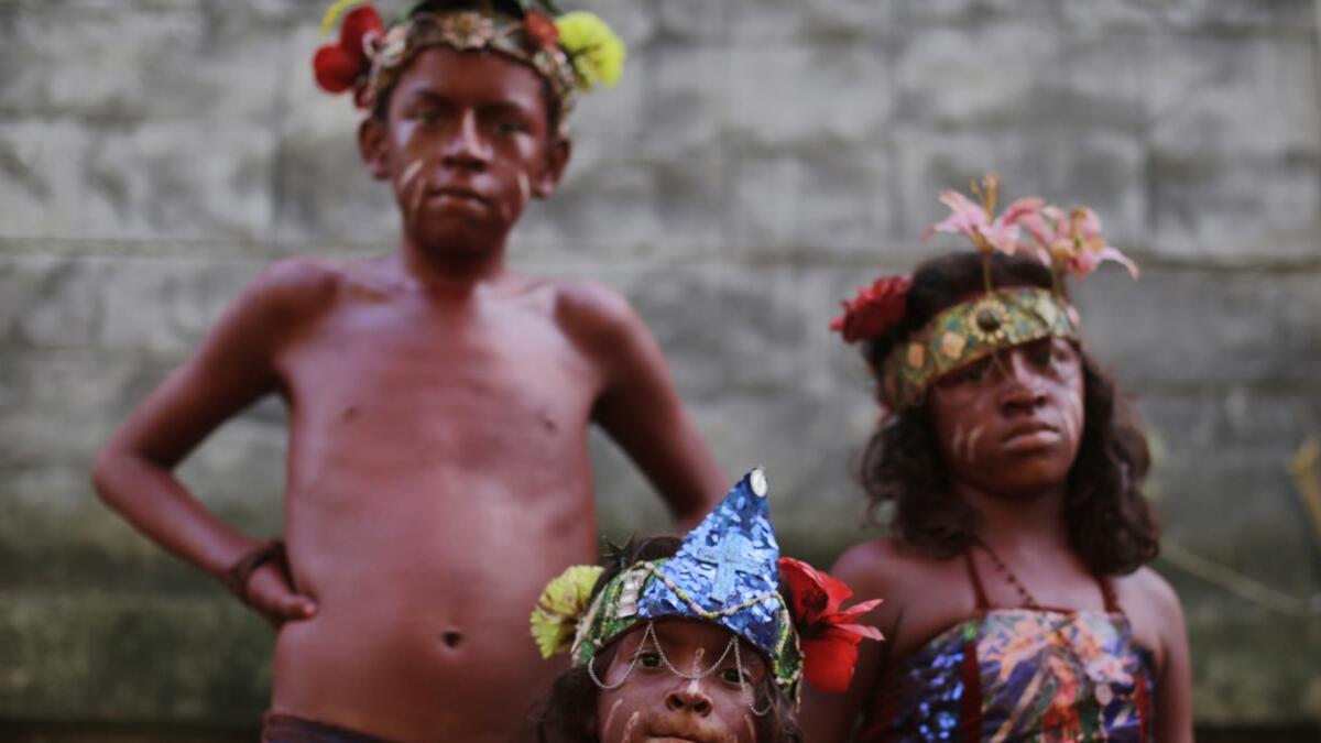 Catholic faithful children smeared in floor painture take part in the opening of the ten-day celebration of the Santo Domingo de Guzman festival in Managua, on August 1, 2019.  INTI OCON / AFP