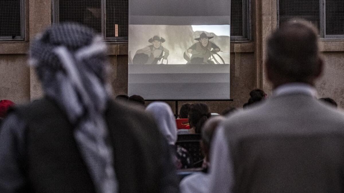 Hinde is screening films in remote villages using just a laptop, projector and a canvas screen. With some films dubbed into Kurdish and others subtitled, he and a team of volunteers want to spread their love of cinema across Rojava, the Kurdish name of the semi-autonomous northeast of war-torn Syria. DELIL SOULEIMAN / AFP