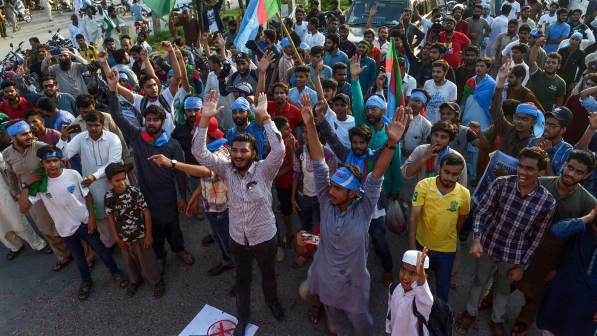 Students of Islami Jamiat-e-Talaba (IJT), a wing of religious political party Pakistan Jamaat-e-Islami (JI), chant anti-Indian slogans during a protest near the Pakistan-India Wagah border.  ARIF ALI / AFP