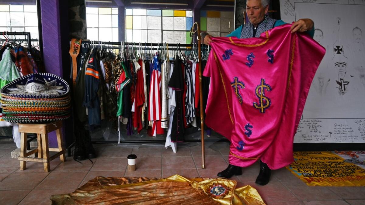 Mexican activist Julia Klug organizes Catholic outfits in Mexico City on August 08, 2019. RODRIGO ARANGUA / AFP
