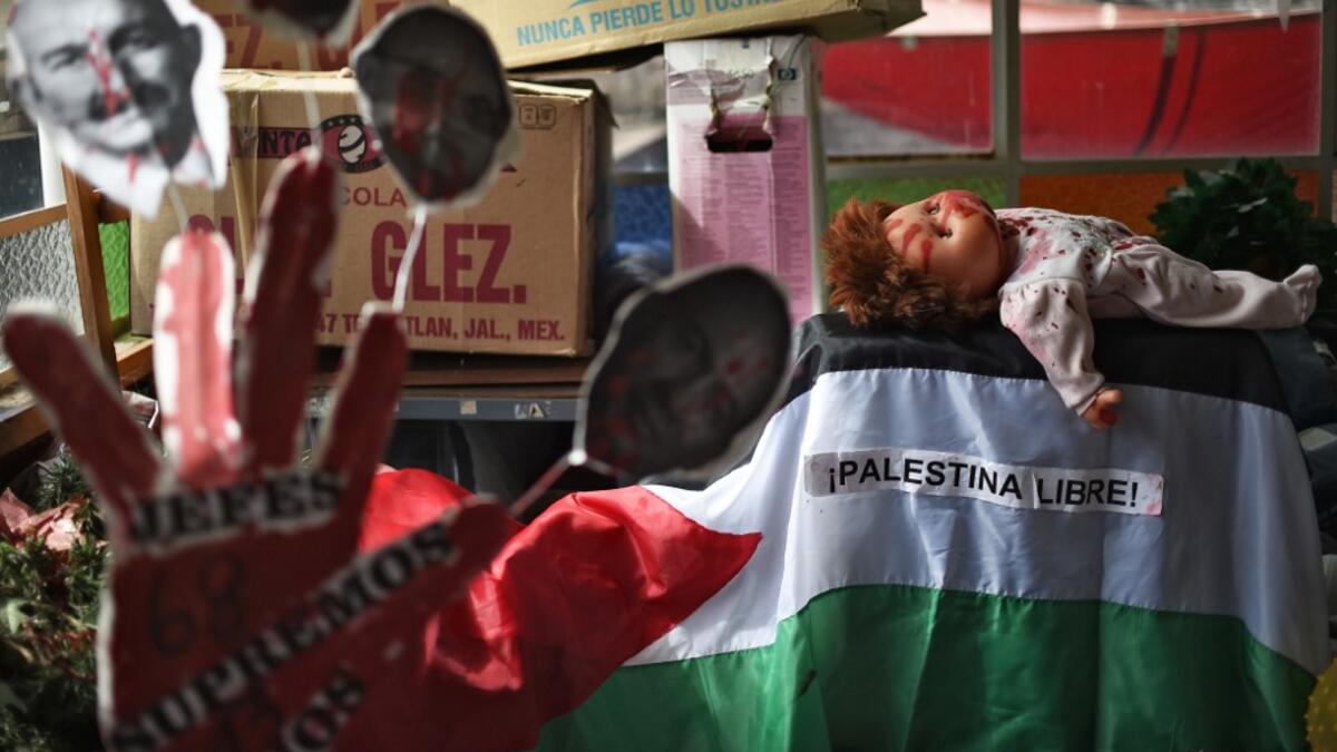 View of parts of objects used by Mexican activist Julia Klug in protests, including a flag reading "Free Palestine" in Mexico City on August 08, 2019. RODRIGO ARANGUA / AFP