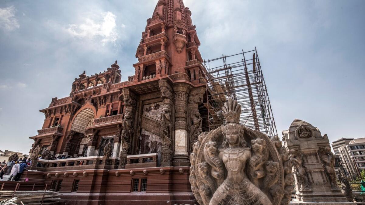 This picture taken on August 18, 2019 shows restoration works ongoing at the historic "Le Palais Hindou" (also known as the "Baron Empain Palace") built by in the early 20th century by Belgian industrialist Edouard Louis Joseph, Baron Empain, in the classical Khmer architectural style of Cambodia's Angkor Wat, in the Egyptian capital Cairo's northeastern Heliopolis district.  Khaled DESOUKI / AFP