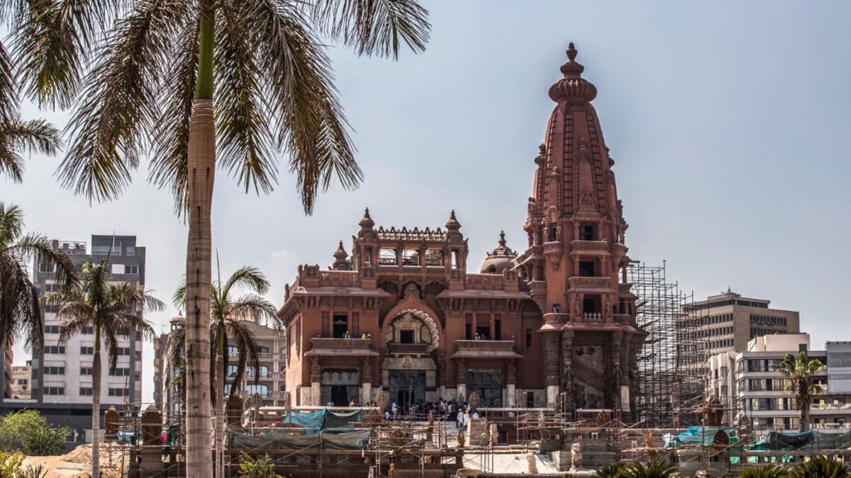 This picture taken on August 18, 2019 shows restoration works ongoing at the historic "Le Palais Hindou" (also known as the "Baron Empain Palace") built by in the early 20th century by Belgian industrialist Edouard Louis Joseph, Baron Empain, in the classical Khmer architectural style of Cambodia's Angkor Wat, in the Egyptian capital Cairo's northeastern Heliopolis district.  Khaled DESOUKI / AFP