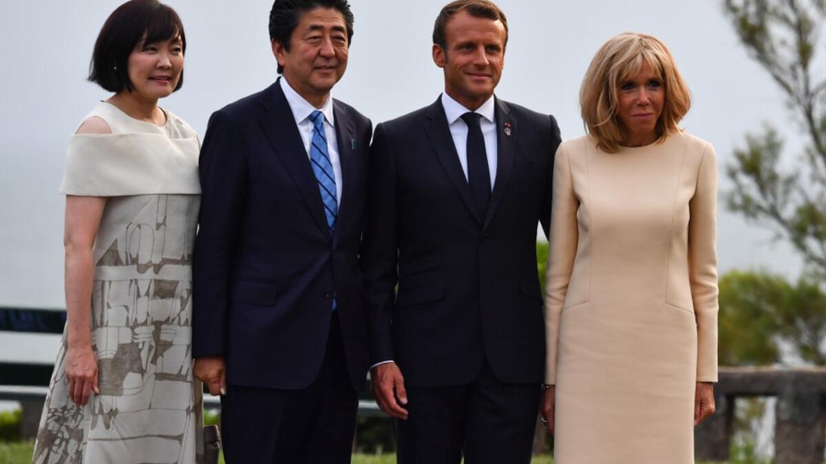 Shadowed by the threat of global recession, a U.S. trade war with China and the possibility of one against Europe, the posturing by leaders of the G-7 rich democracies began well before they stood together for a summit photo. Nicholas Kamm / AFP