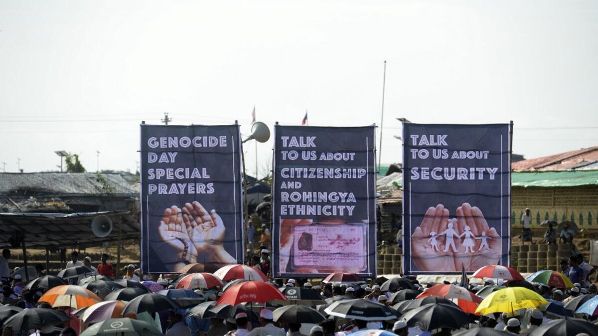 Rohingya refugees attend a ceremony organised to remember the second anniversary of a military crackdown that prompted a massive exodus of people from Myanmar to Bangladesh, at the Kutupalong refugee camp in Ukhia on August 25, 2019. MUNIR UZ ZAMAN / AFP