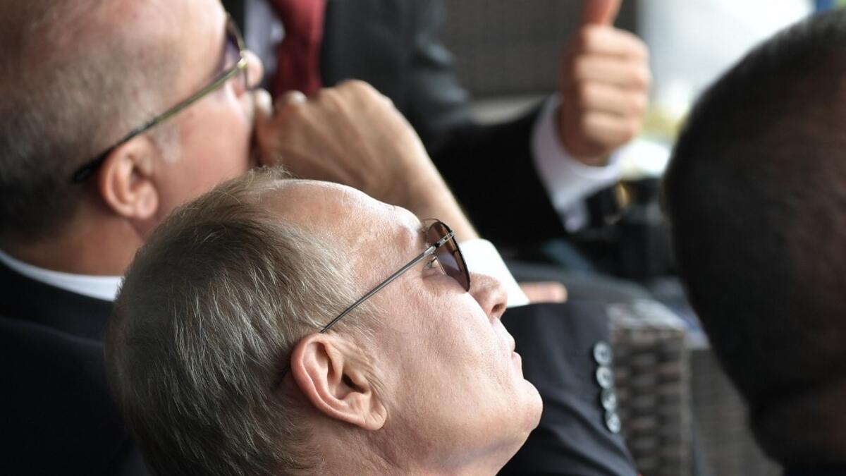 Turkish President Recep Tayyip Erdogan (L) and his Russian counterpart Vladimir Putin (R) watch an air show during the MAKS-2019 International Aviation and Space Salon opening ceremony in Zhukovsky outside Moscow on August 27, 2019.  Alexey NIKOLSKY / SPUTNIK / AFP
