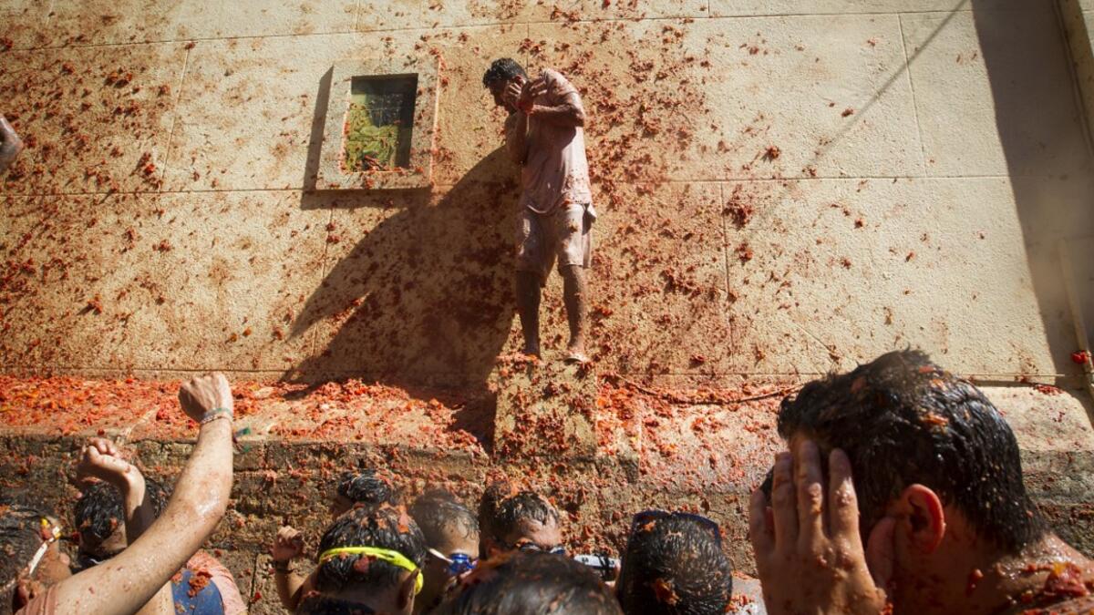 The iconic fiesta, which is billed at "the world's biggest food fight" has become a major draw for foreigners, in particular from Britain, Japan and the United States. JAIME REINA / AFP