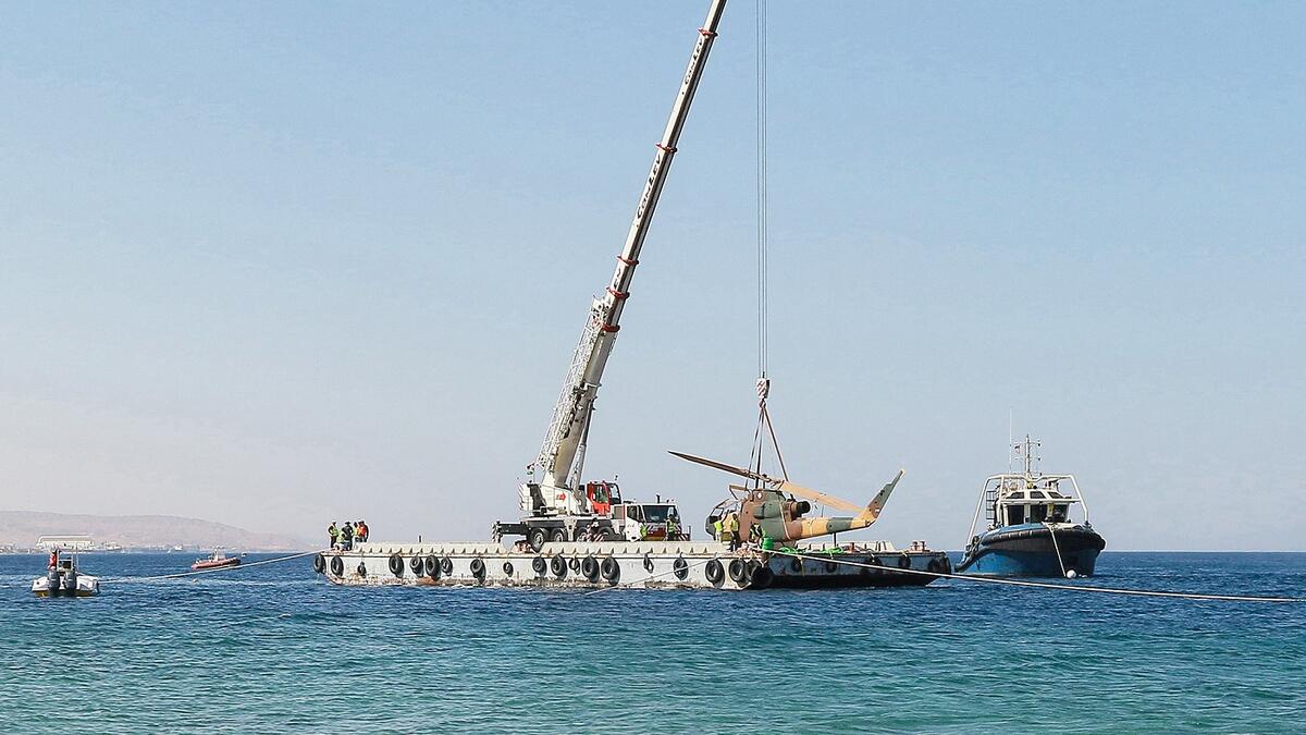 Off the coast of Aqaba, a floating crane manoeuvres into position to build Jordan’s latest tourist attraction: an underwater museum of military vehicles, located on top of a coral reef. (AFP)
