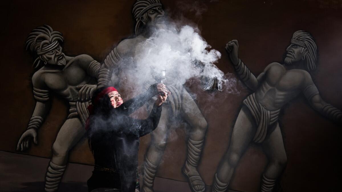Mexican Beatriz Campos, player of a pre-Columbian ballgame called "Ulama" -in Nahuatl indigenous language- performs the "Copal" ceremony ahead of a match at the FARO Poniente cultural center in Mexico City on August 21, 2019. Omar Torres / AFP