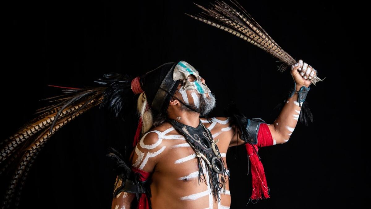 Mexican dancer Jorge de Jesus Trujillo, who represents "Mictlantecuhtli" (deity of the dead in the Mexica mythology) in a pre-Columbian ballgame called "Ulama" -in Nahuatl indigenous language-, poses for a photograph during a photo session at the FARO Poniente cultural center in Mexico City on August 21, 2019. Omar TORRES / AFP