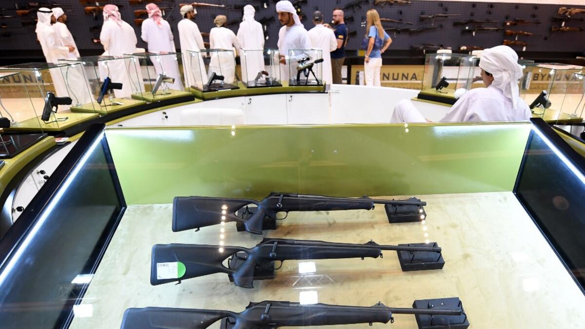 This picture taken on August 31, 2019 shows various rifles and pistols on display during the Abu Dhabi International Hunting and Equestrian exhibition (ADIHEX) in the UAE capital Abu Dhabi.  KARIM SAHIB / AFP