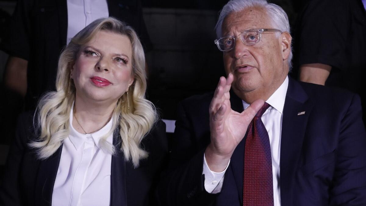 US ambassador to Israel David Friedman (R) speaks with Sara Netanyahu, wife of the Israeli Prime Minister, as they attend a ceremony commemorating the eve of the 18th anniversary of the September 11, 2001 terror attacks in New York City, at the 9/11 Living Memorial Plaza on a hill overlooking Jerusalem AHMAD GHARABLI / AFP