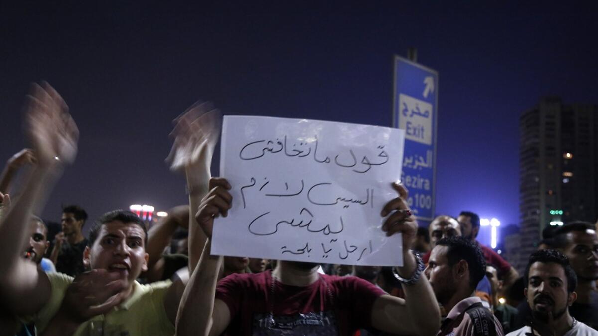 Egyptian protesters shout slogans as they take part in a protest calling for the removal of President Abdel Fattah al-Sisi in Cairo's downtown on September 20, 2019.STR / AFP