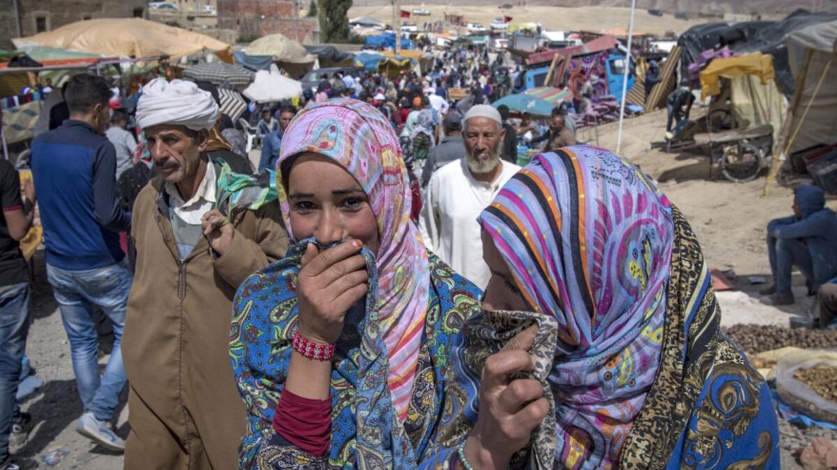 Amazigh (Berber) men and women take part in the annual "Engagement Moussem" festival near the village of Imilchil in central Morocco's high Atlas Mountains on September 21, 2019. Each year in the High Atlas Mountains hamlet of Ait Amer, tribes celebrate with dances and music, the collective wedding of young Amazigh couples during the traditional festival of "Engagement Moussem". FADEL SENNA / AFP