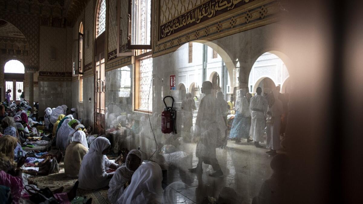 Worshippers enter the Great Mosque of the Mourides on September 27, 2019 in Dakar, ahead of its inauguration. Senegal's influential Mouride Brotherhood will inaugurate a 30,000-capacity mosque in the capital Dakar, said to be the largest in West Africa. JOHN WESSELS / AFP