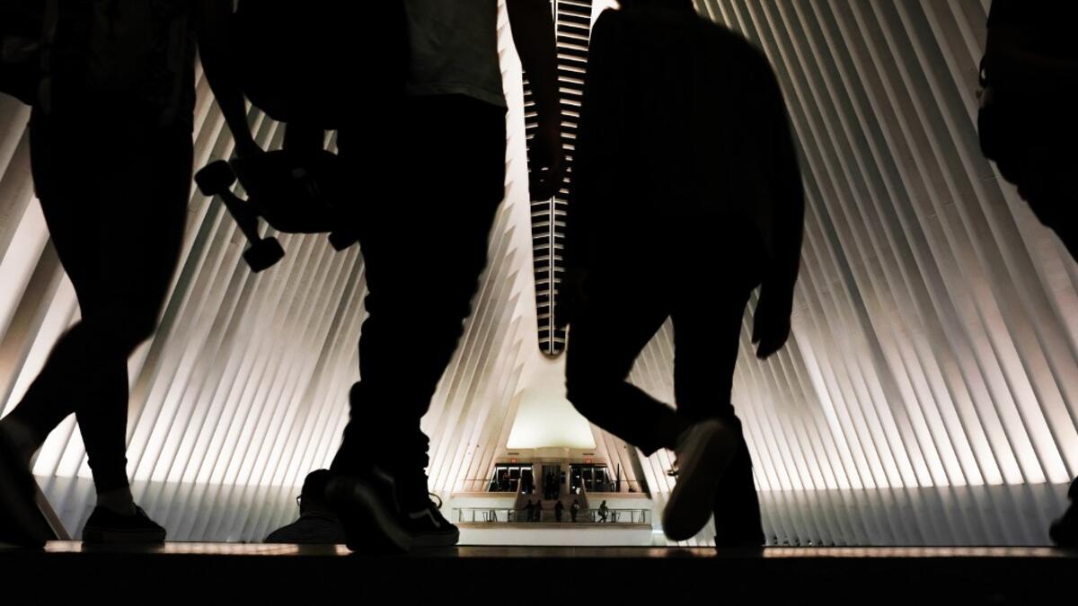 People enter the Oculus, the sculpture that tops the World Trade Center Transportation Hub, in New York City. New York City is preparing to commemorate the 18th anniversary of the attacks on the World Trade Center in which 2,996 people were killed and over 6000 were injured. Spencer Platt/Getty Images/AFP SPENCER PLATT / GETTY IMAGES NORTH AMERICA / AFP