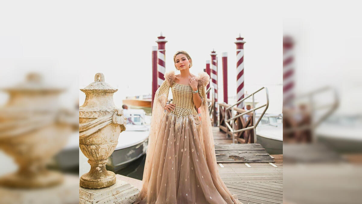 Kuwaiti poet and TV personality Noha Nabil dazzled in a golden dress by fashion house LaBourjoisie