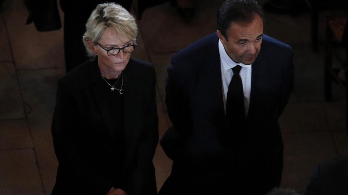 Claude Chirac, daughter of late French president Jacques Chirac, and her husband Frederic Salat-Baroux leave Saint Sulpice church in the Paris following her father's final service on September 30, 2019.  Francois Mori / POOL / AFP