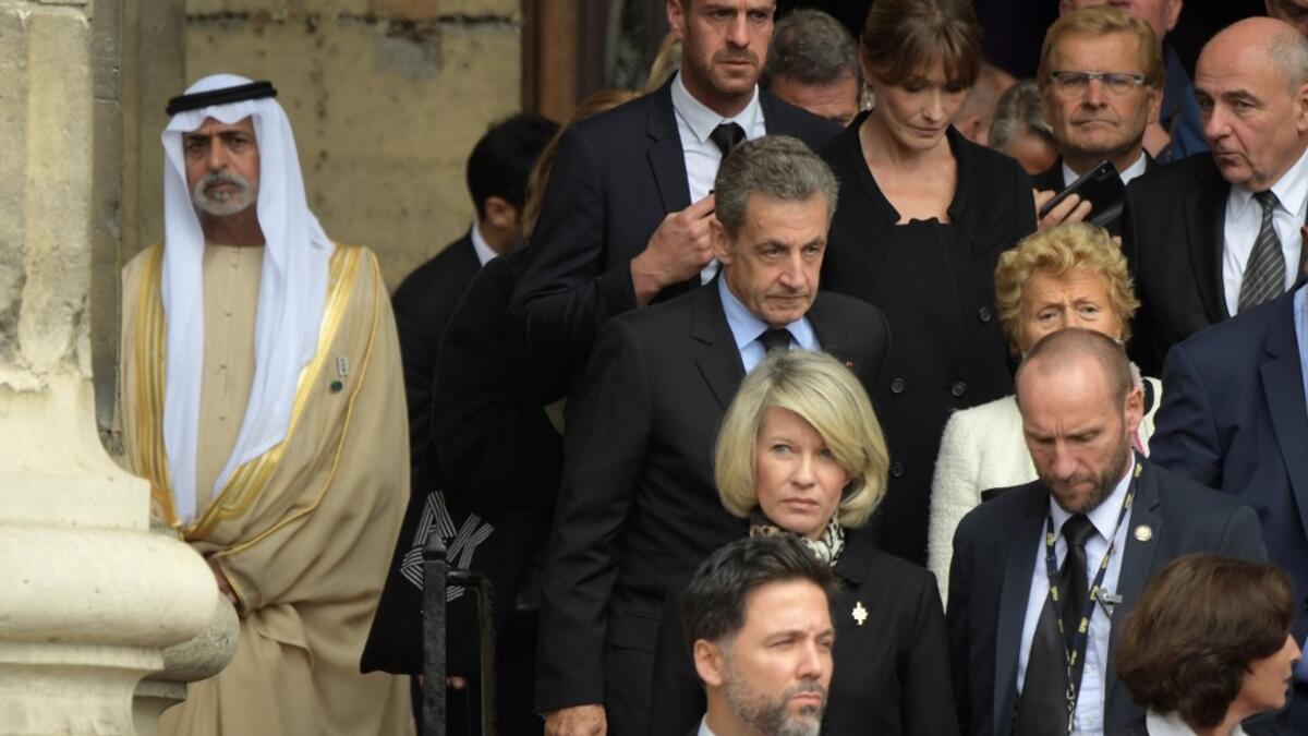France's former President Nicolas Sarkozy (C) leaves after attending a church service for former French President Jacques Chirac at the Saint-Sulpice church in Paris on September 30, 2019. Former French President Jacques Chirac died on September 26, 2019 at the age of 86. Eric FEFERBERG / AFP