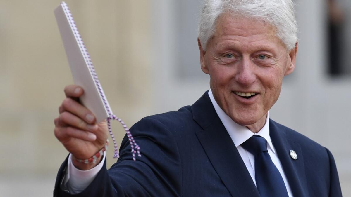 Former US President Bill Clinton gestures as he leaves The Elysee Presidential Palace in Paris on September 30, 2019, following a luncheon after a church service for former French President Jacques Chirac. Former French President Jacques Chirac died on September 26, 2019 at the age of 86. Bertrand GUAY / AFP