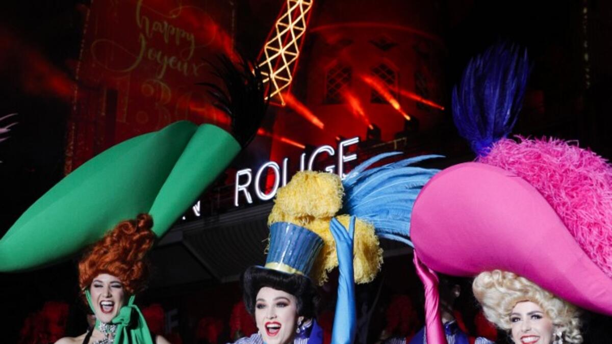 Moulin Rouge dancers pose during the celebration of the 130th anniversary of the French oldest cabaret, on October 6, 2019 in Paris.  GEOFFROY VAN DER HASSELT / AFP