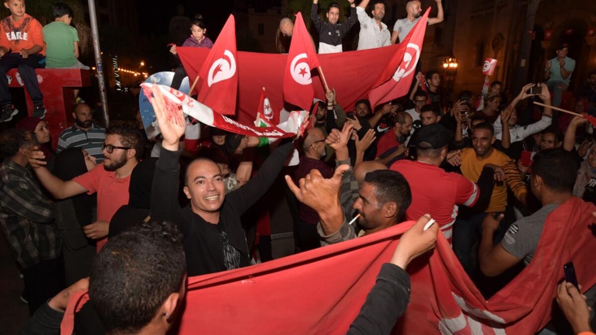 Conservative academic Kais Saied, a political outsider, won a landslide victory Sunday in Tunisia's presidential runoff, sweeping aside his rival, media magnate Nabil Karoui, state television said. Fethi Belaid / AFP