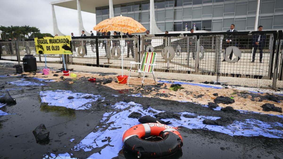 Greenpeace denounced what they call government negligence due to large blobs of oil staining more than 130 beaches in northeastern Brazil began appearing in early September and have now turned up along a 2,000km stretch of the Atlantic coastline. Sérgio Lima / AFP