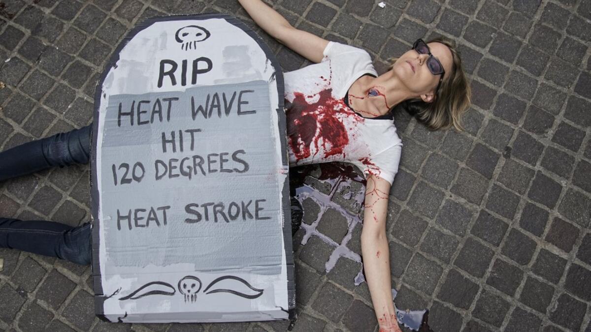 Environmental activists participate in a die-in during a rally for action against climate change in the Financial District October 7, 2019 in New York City. Drew Angerer / GETTY IMAGES NORTH AMERICA / AFP