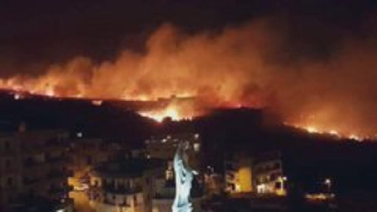 At least one Lebanese Army helicopter was seen working to fight the blaze. (Twitter)