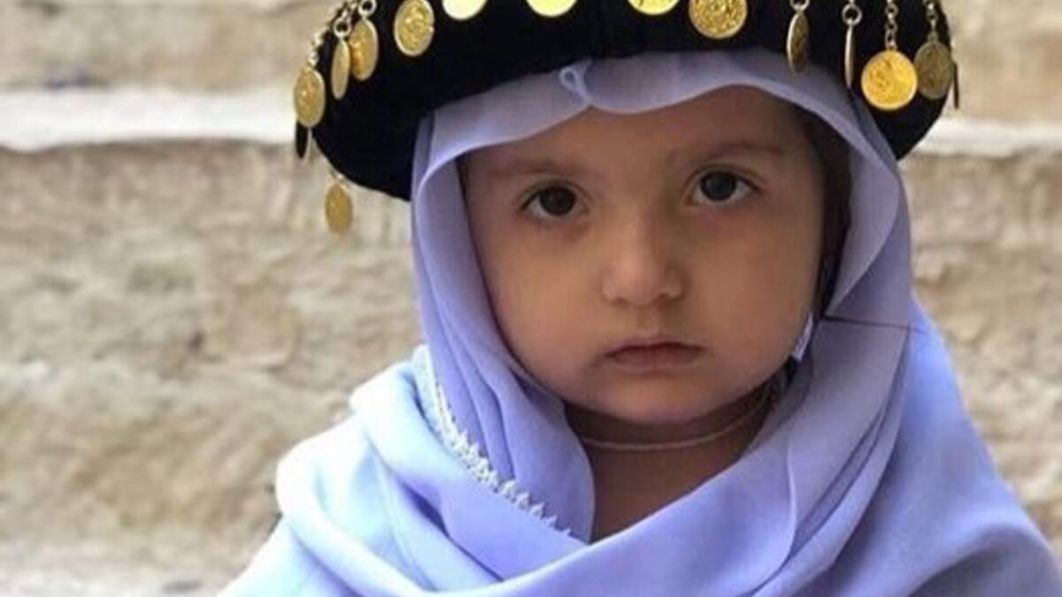 Photo of little Yezidi child in Yezidi traditional clothes in Lalish Temple the holiest Yezidi Religious Site in the world (Twitter)