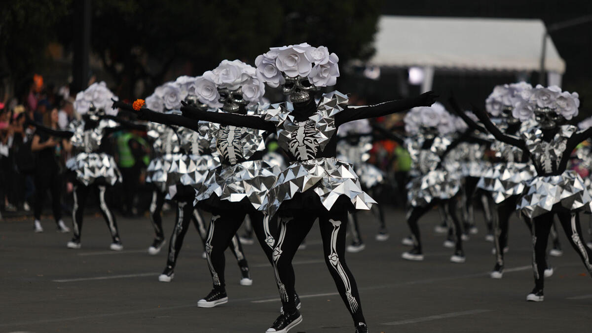 Participants in costume perform during the annual International Day of the Dead Parade in Mexico City  Emilio Espejel / Anadolu Agency / Getty