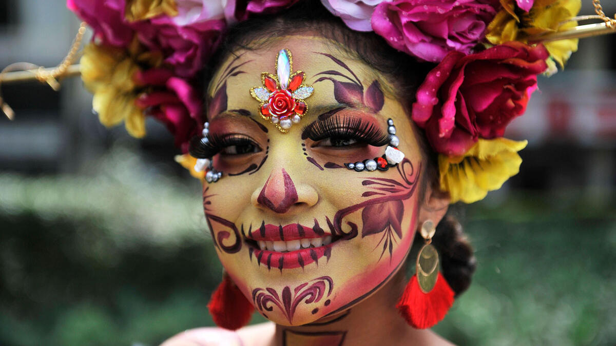 A woman dressed as Catrina takes part in the Catrinas Parade along Reforma Avenue in Mexico City Claudio Cruz / AFP / Getty