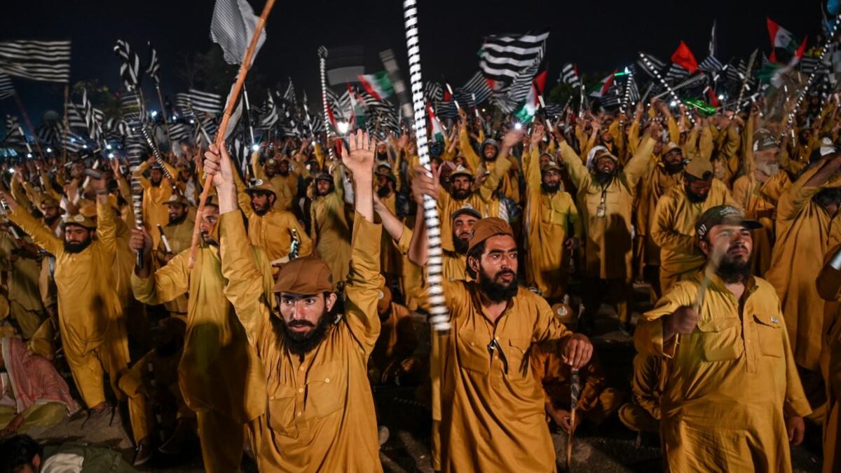 Supporters of Islamic political party Jamiat Ulema-e-Islam (JUI-F) react as they listen to the speech of their leader Maulana Fazlur Rehman during an anti-government "Azadi (Freedom) March" in Islamabad Aamir QURESHI / AFP
