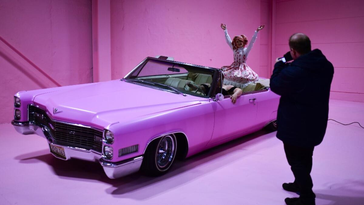 Instagram influencer "Anmaykaa" is being photographed at the "Supercandy Pop-Up Museum Vol. 2" in Cologne, western Germany on November 1, 2019. It is an interactive museum and offers a photo backdrop for social media at 25 stations. INA FASSBENDER / AFP